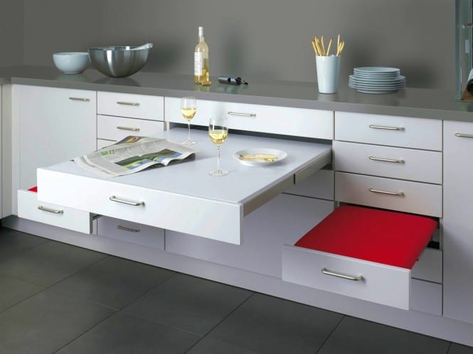 modern kitchen white with seating made of drawers as a space-saving idea for small kitchens