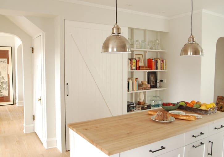 small kitchen white modern furnishing with space-saving wall shelves in wall niche