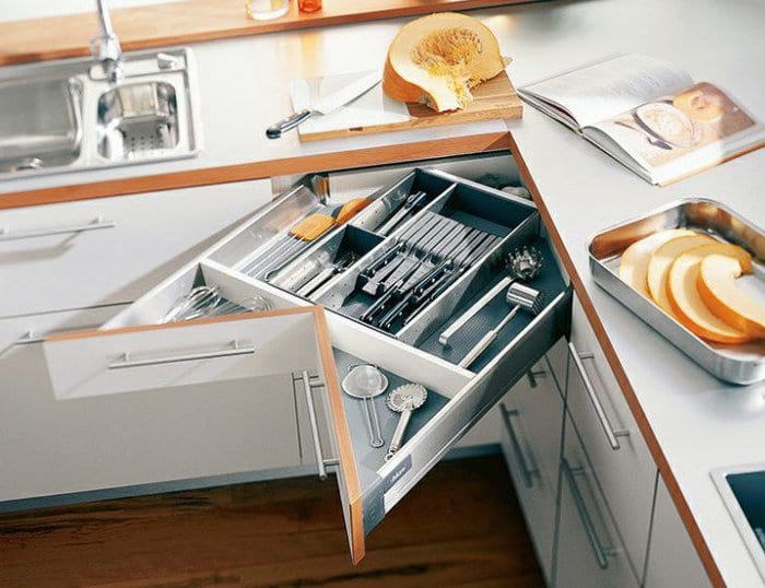 creative kitchen furnishing idea with space-saving drawers on the corner of the kitchen worktop