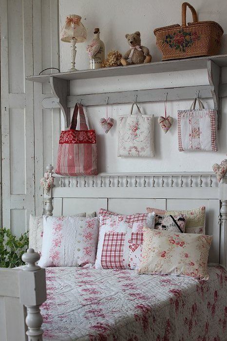 a vintage bedroom in neutrals, with neutral vintage furniture, printed textiles, greenery and toys plus Christmas bedding