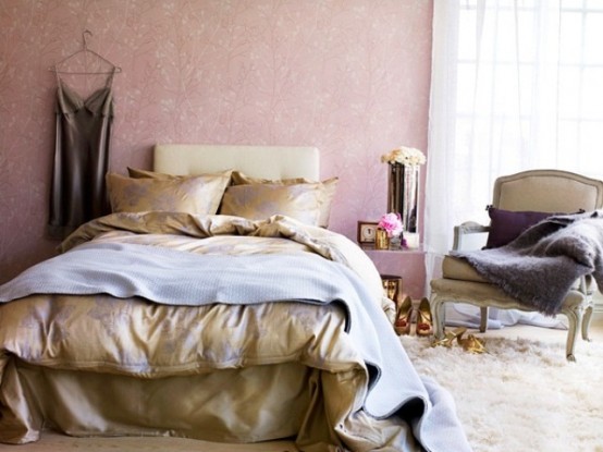 a chic and beautiful feminine bedroom with pink wallpaper walls, elegant furniture, floral bedding and a fluffy rug on the floor