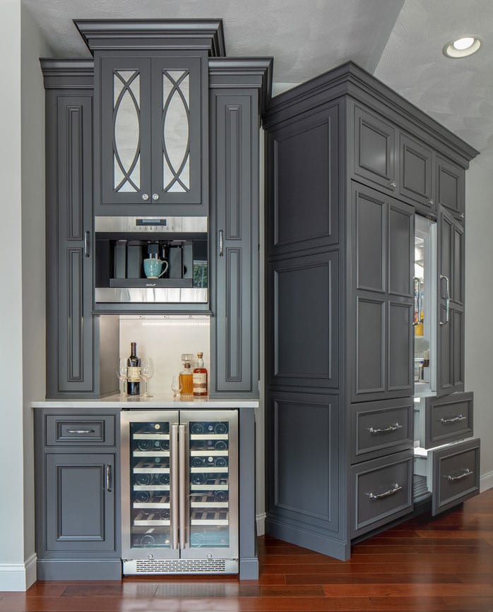 original idea for a mini-bar and built-in fridge with freezer compartments in the classic kitchen cupboard