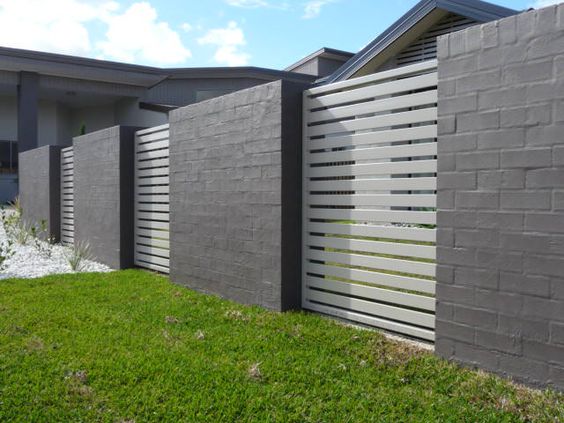 brick and metal fence