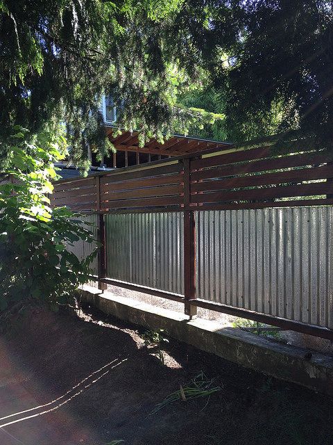 metal sheets and wood fence