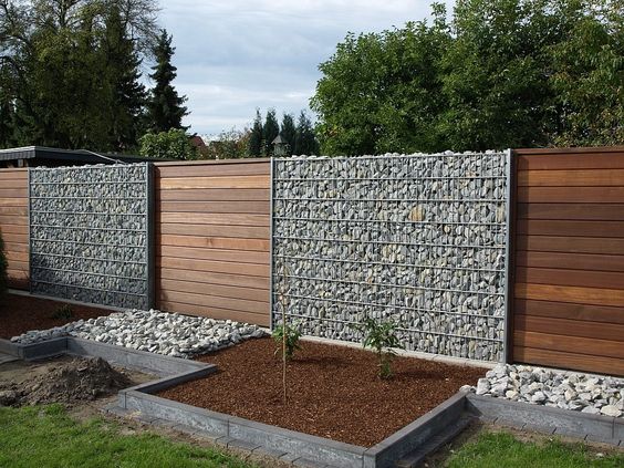 gabion and wood fence