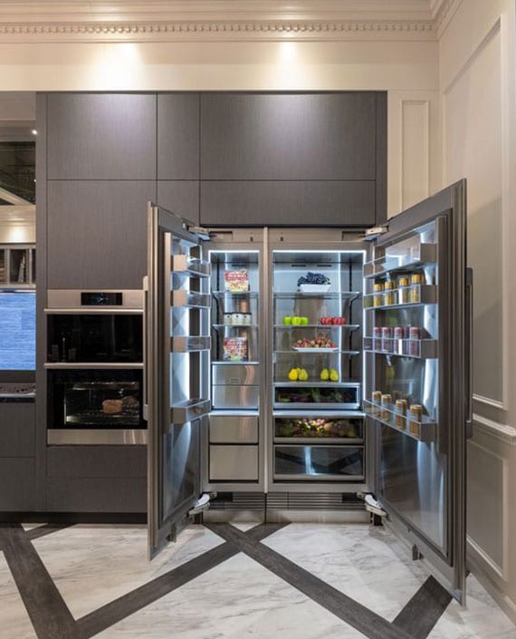 Modern kitchen equipment with built-in appliances such as a side-by-side refrigerator with a separate freshness zone for fruit and vegetables