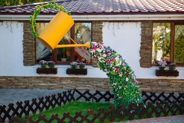 Watering can spilled flowers