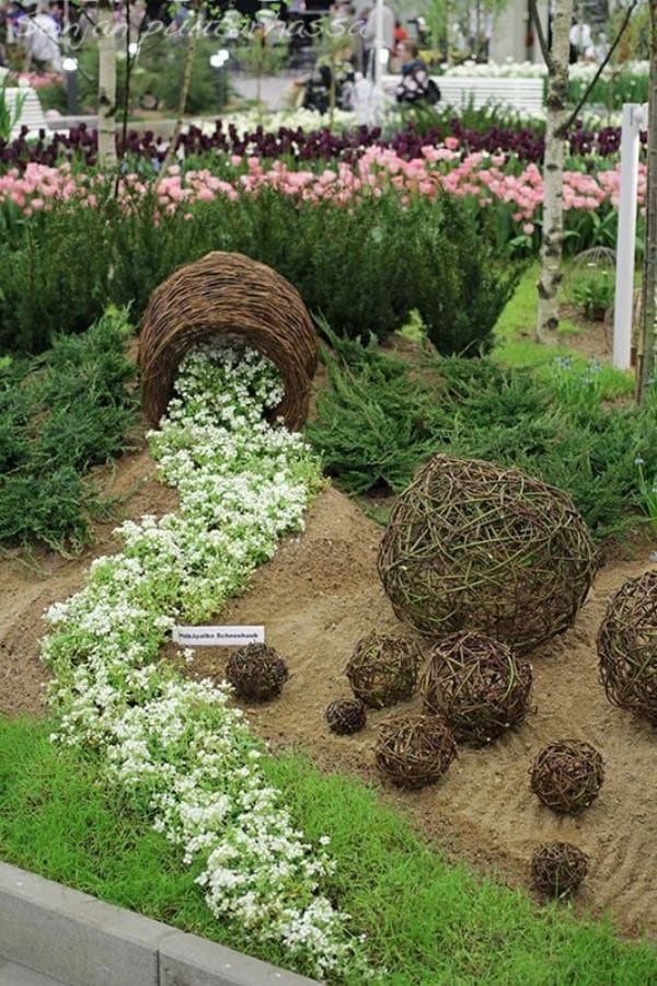 White and green flowers with twig pots